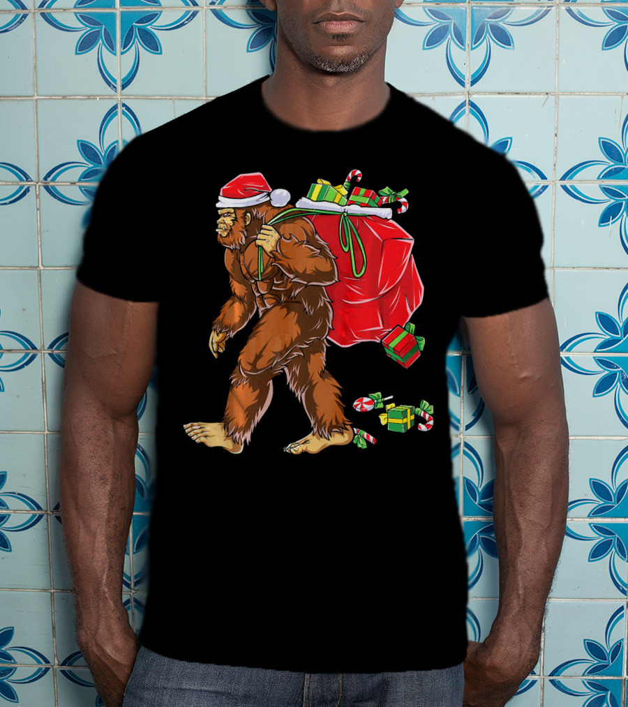 Bigfoot Santa Carrying Gifts With Candy Canes T-Shirt