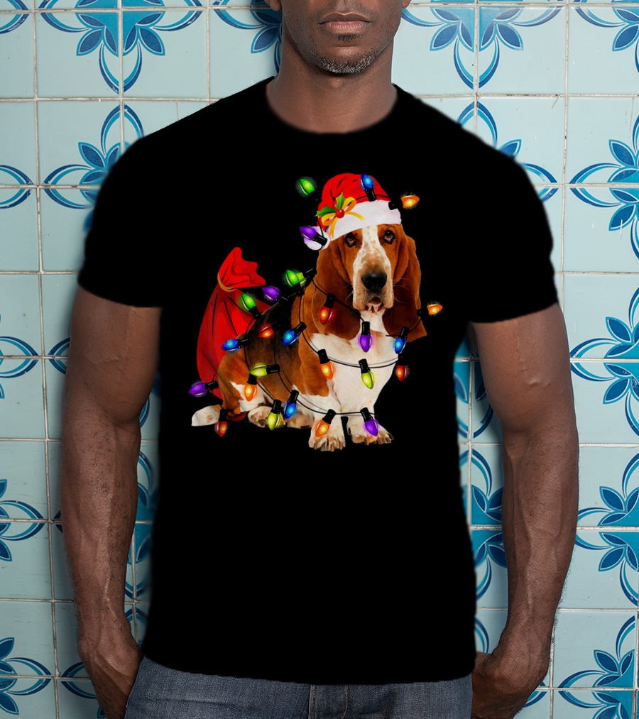 Basset Hound Wrapped In Christmas Lights With Santa Hat And Red Sack T-Shirt