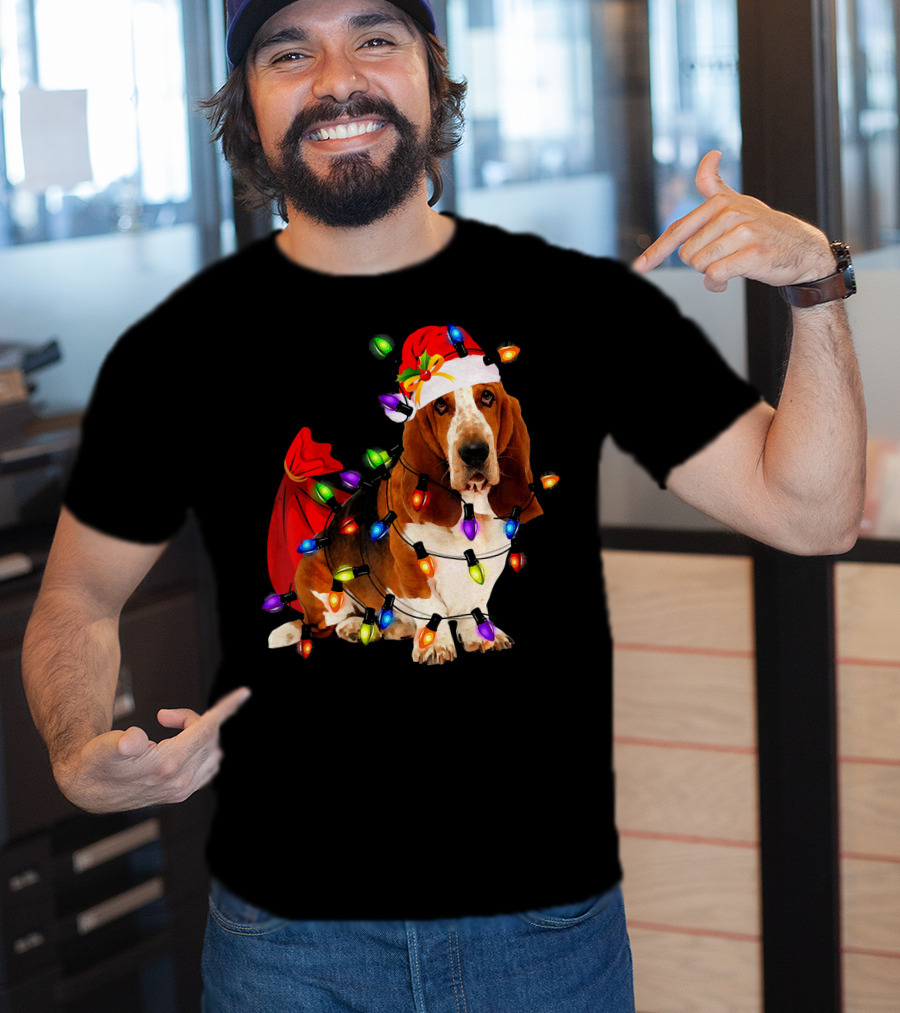 Basset Hound Wrapped In Christmas Lights With Santa Hat And Red Sack T-Shirt