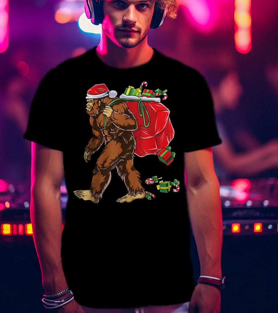 Bigfoot Santa Hat Carrying Christmas Presents And Candy Canes T-Shirt