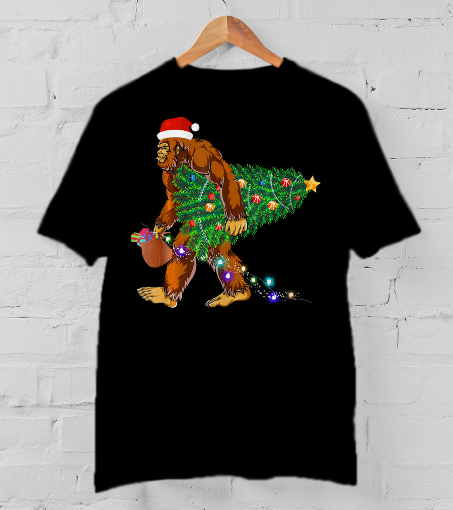 Santa Hat Bigfoot Holding Christmas Tree With Lights And Gifts T-Shirt