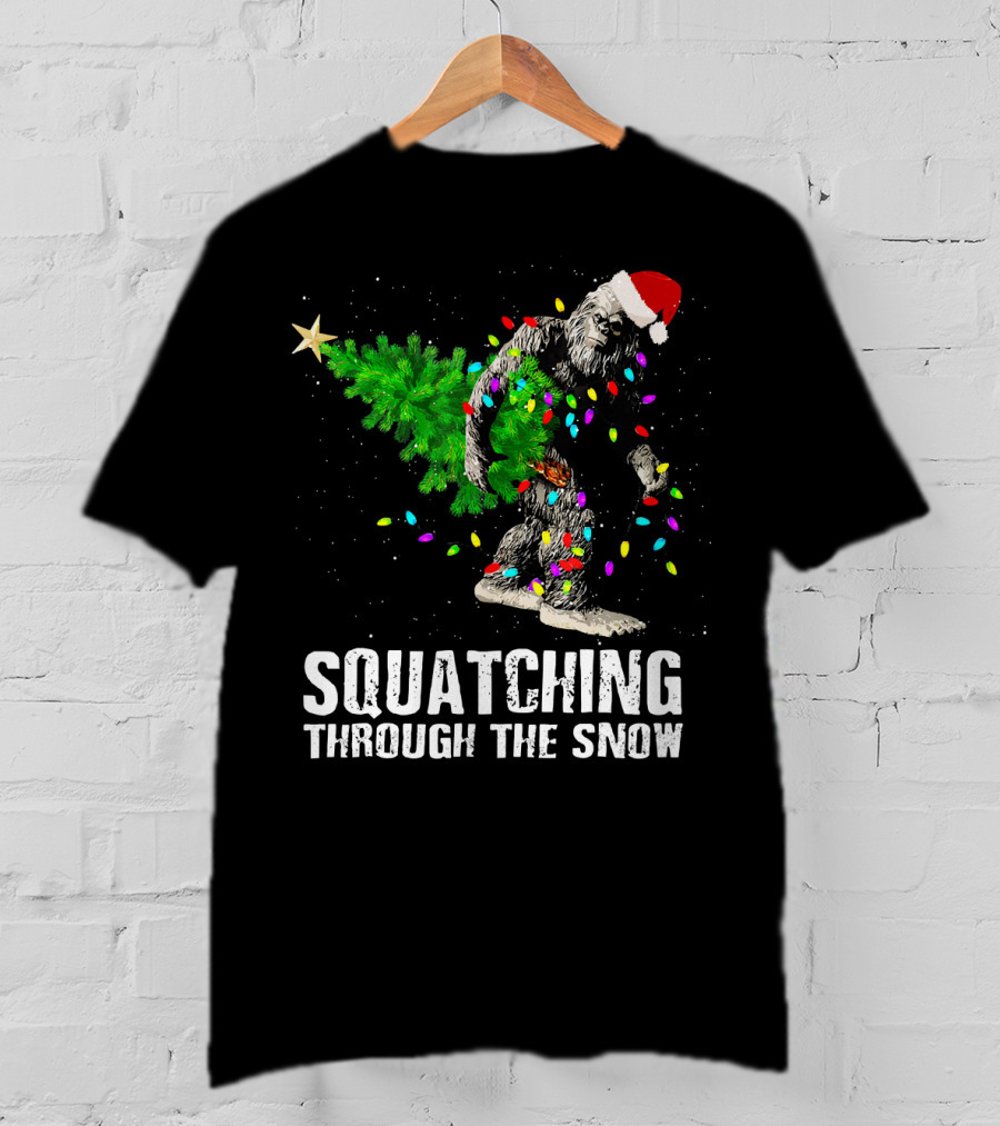 Squatching Through The Snow Bigfoot Christmas Lights Santa Hat T-Shirt
