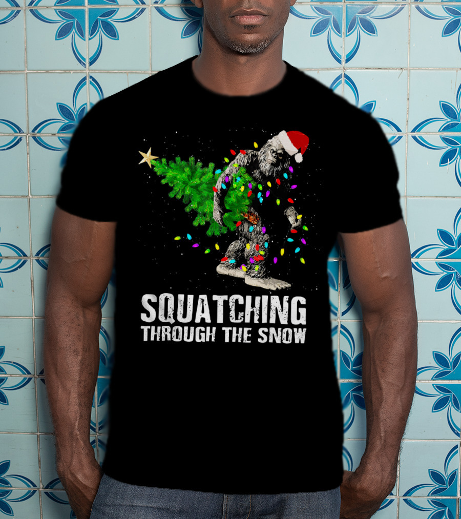 Squatching Through The Snow Bigfoot Christmas Lights Santa Hat T-Shirt