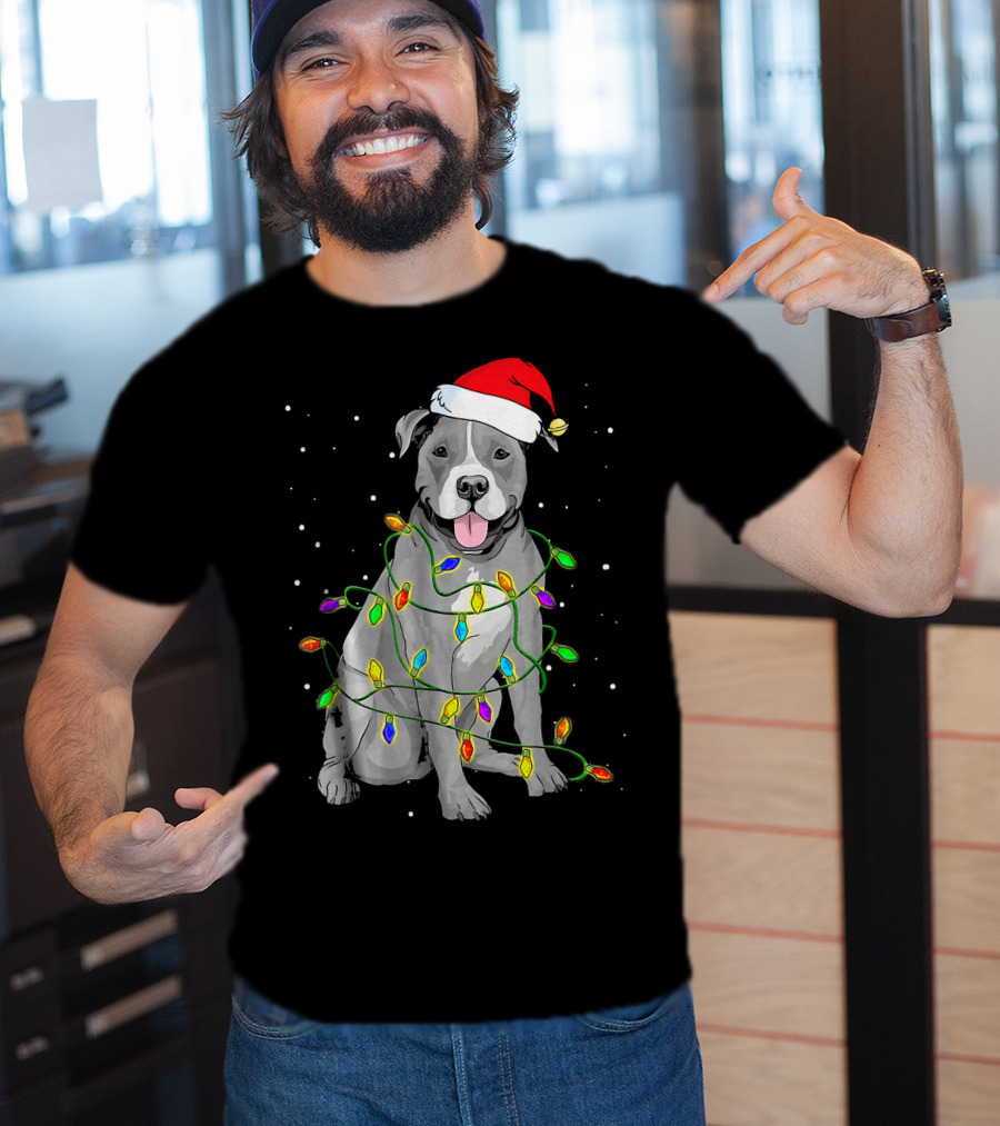 Pitbull In Santa Hat Wrapped In Christmas Lights With Snowy Background T-Shirt