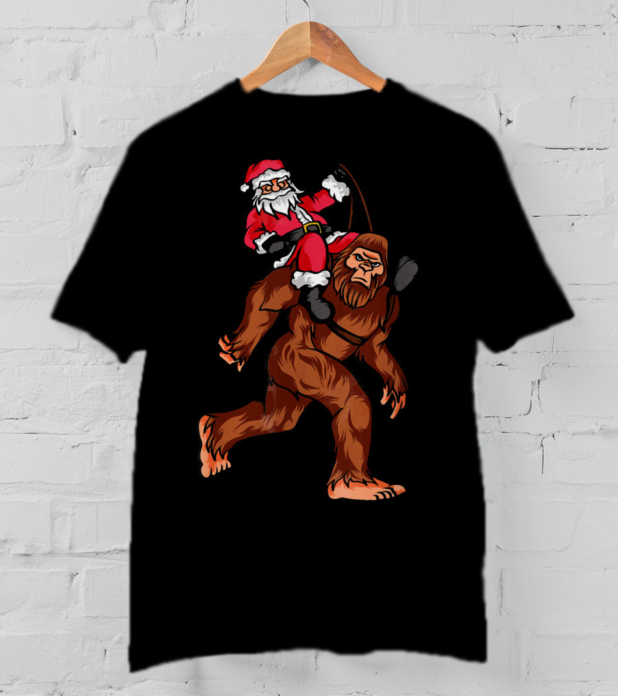 Bigfoot Carrying Santa Claus In Christmas T-Shirt