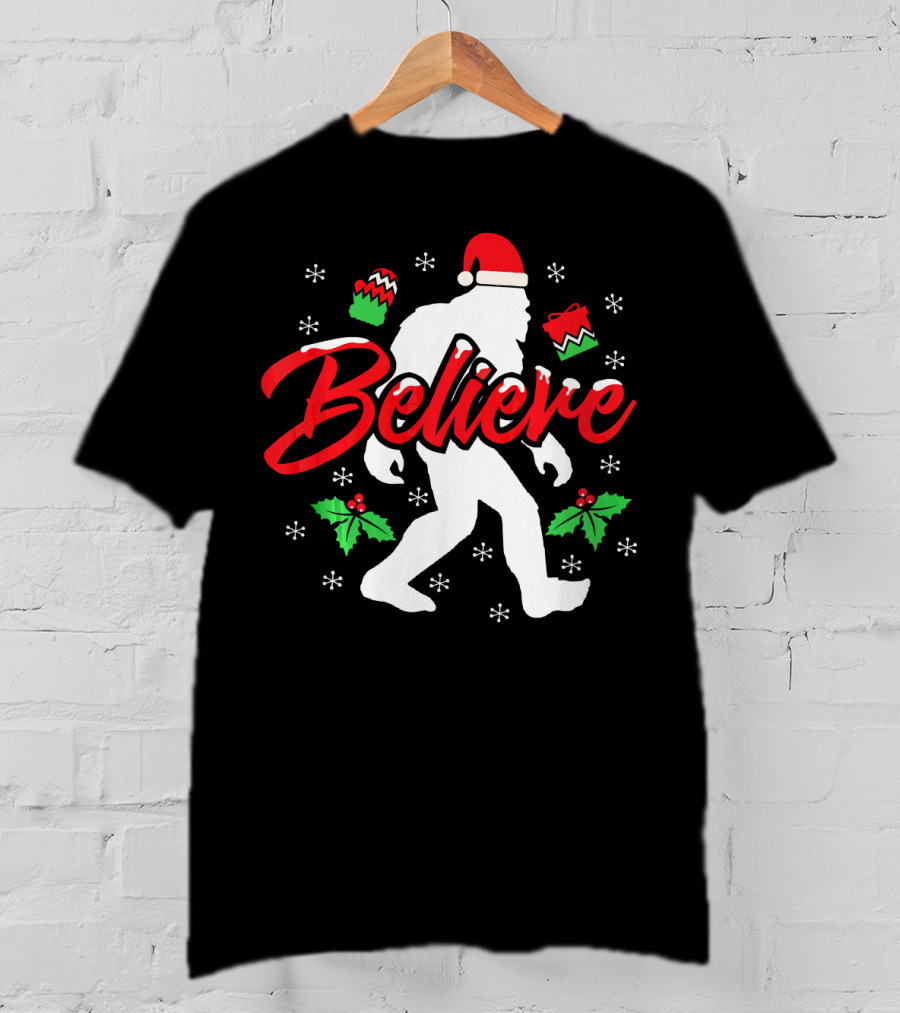 Believe Bigfoot Christmas Santa Hat Snowflakes Holly T-Shirt