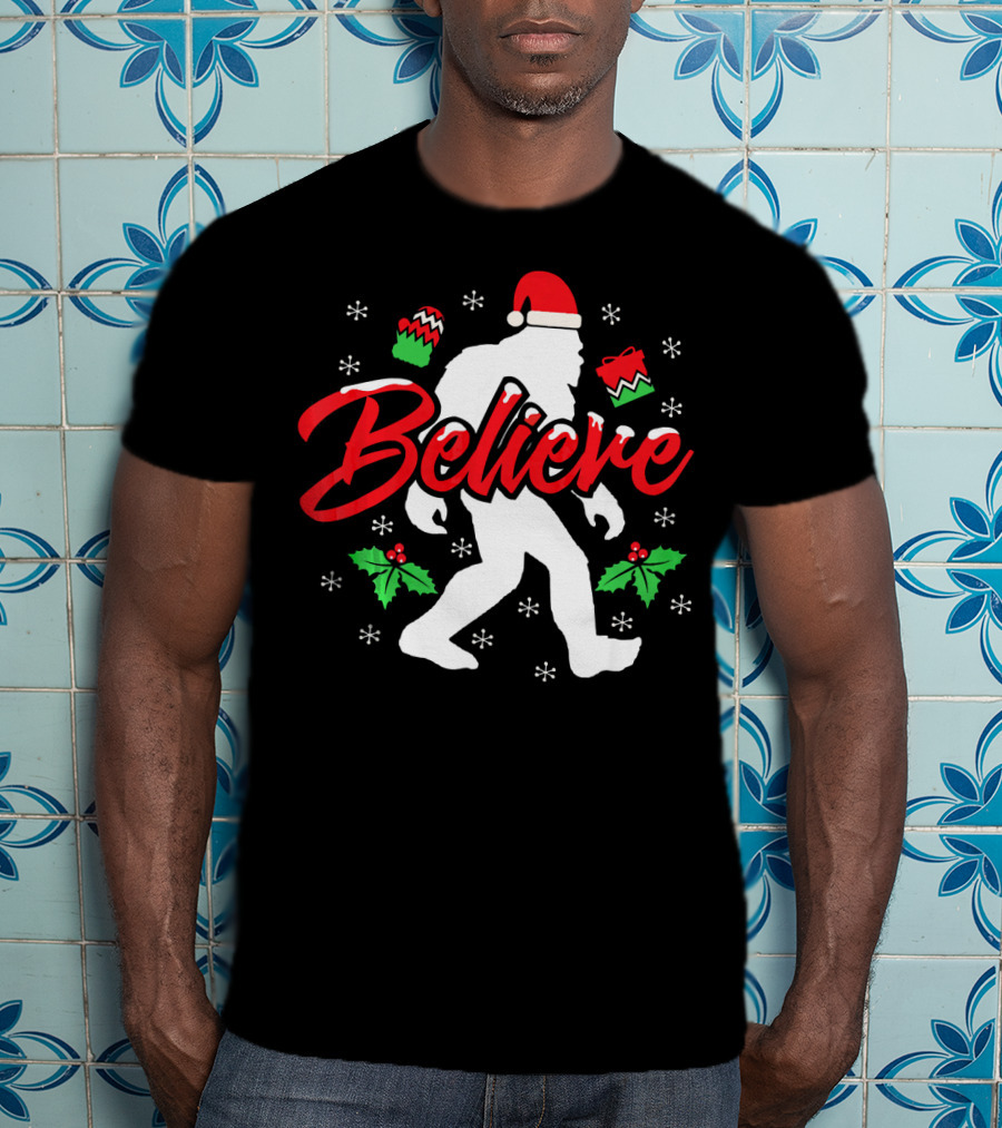 Believe Bigfoot Christmas Santa Hat Snowflakes Holly T-Shirt