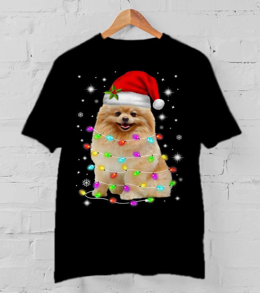 Pomeranian Pup Wrapped In Christmas Lights With Santa Hat And Festive Glow T-Shirt