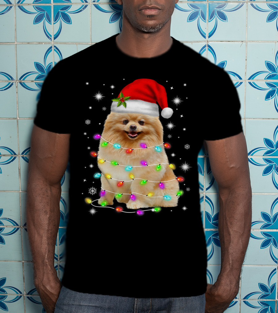 Pomeranian Pup Wrapped In Christmas Lights With Santa Hat And Festive Glow T-Shirt