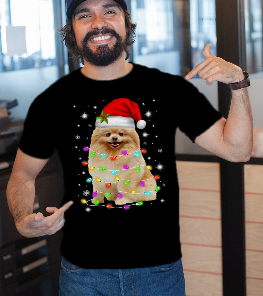 Pomeranian Pup Wrapped In Christmas Lights With Santa Hat And Festive Glow T-Shirt