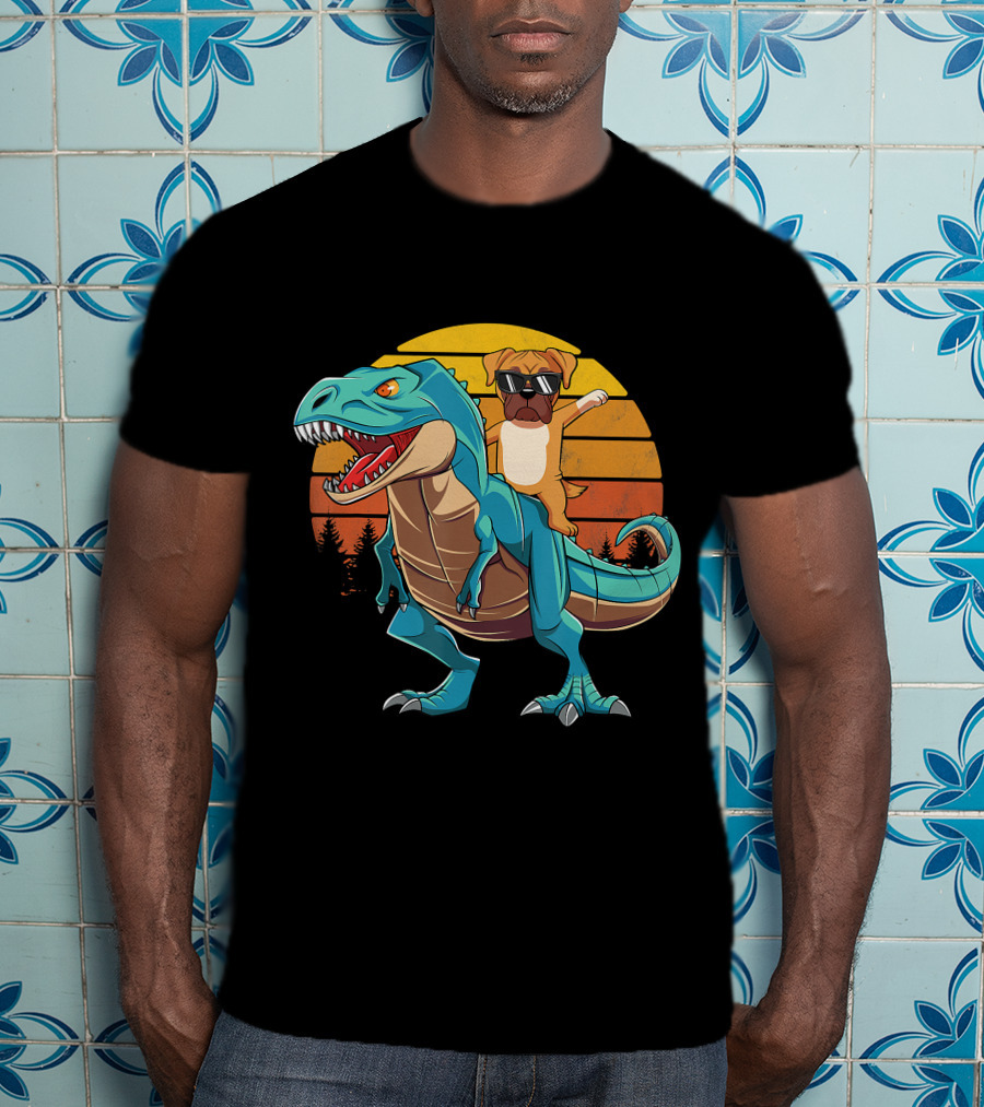 Boxer Dog With Sunglasses Riding Blue T-Rex Against Sunset Background T-Shirt